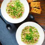 Overhead Italian pasta e piselli with peas, pancetta, mint and ditalini served with garlic ciabatta.