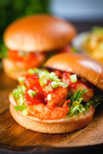 King prawn sandwich with a bloody Mary sauce and celery on a brioche bun with the lid off.