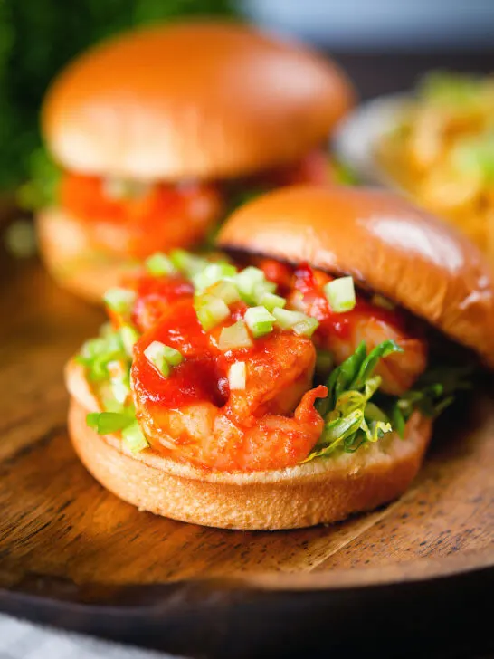 King prawn sandwich with a bloody Mary sauce and celery on a brioche bun with the lid off.
