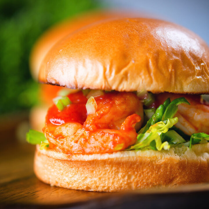 Prawn sandwich with a bloody Mary inspired tomato sauce served on a brioche bun.