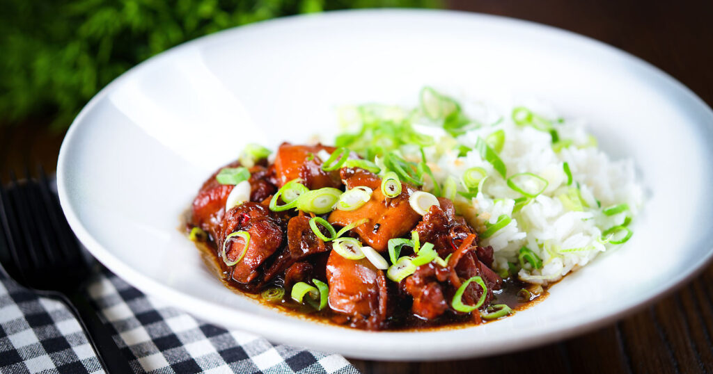 Vietnamese-influenced coconut caramel chicken served with jasmine rice and spring onions.