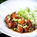 Vietnamese coconut caramel chicken served with jasmine rice and spring onions.