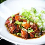 Vietnamese coconut caramel chicken served with jasmine rice and spring onions.