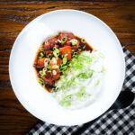Vietnamese-influenced coconut caramel chicken served with jasmine rice and spring onions.