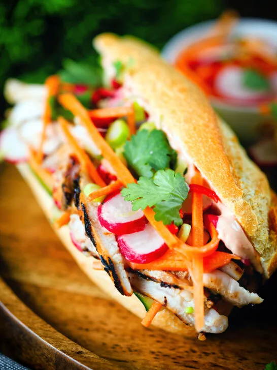 Vietnamese-influenced chicken banh mi sandwiches on a French baguette.