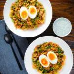 Overhead British-Indian smoked mackerel kedgeree (rice) served with boiled egg.