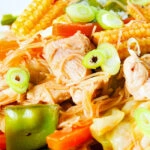 Close-up Filipino chicken and vegetable pancit bihon (rice noodles) aka guisado.
