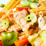 Close-up Filipino chicken and vegetable pancit bihon (rice noodles) aka guisado.