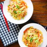 Overhead Filipino chicken and vegetable pancit bihon (rice noodles) aka guisado.