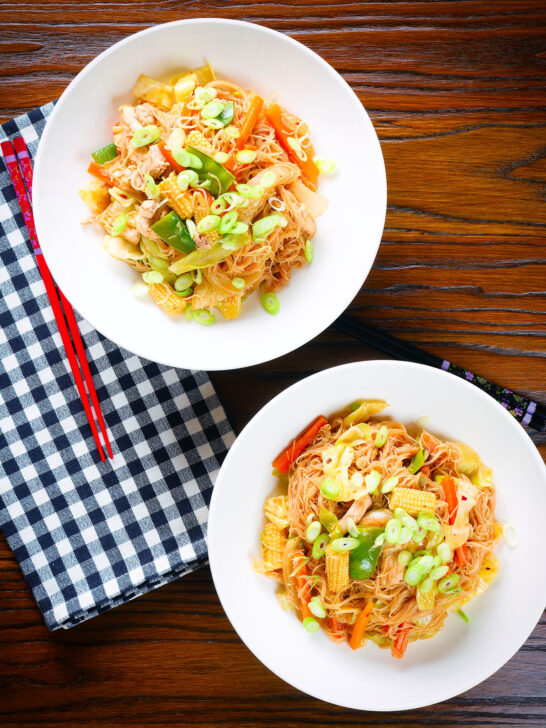 Overhead Filipino chicken and vegetable pancit bihon (rice noodles) aka guisado.