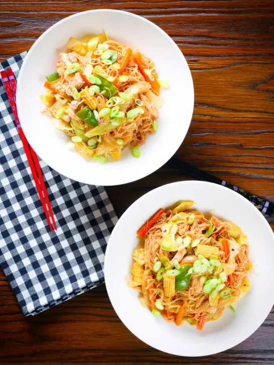 Overhead Filipino chicken and vegetable pancit bihon (rice noodles) aka guisado.
