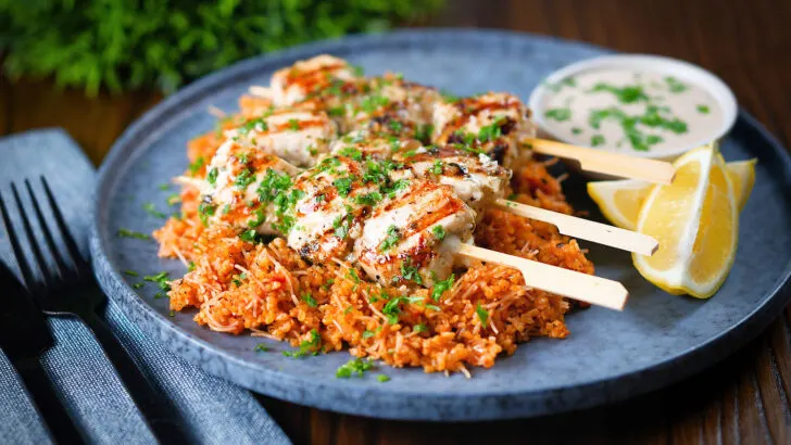 Greek chicken souvlaki skewers served with pourgouri bulgur and a yoghurt sauce.