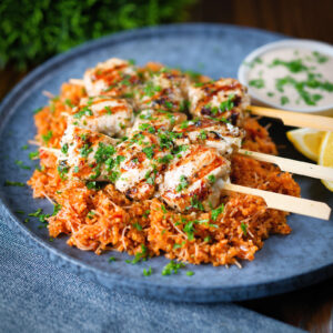 Greek chicken souvlaki skewers served with pourgouri bulgur and a yoghurt sauce.