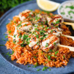 Greek chicken souvlaki kebabs served with pourgouri and a yoghurt sauce.