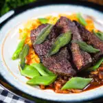 Pan fried calves liver an onion and bacon gravy, swede and carrot mash, beans and sage.