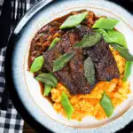 Overhead pan fried calves liver an onion and bacon gravy, swede and carrot mash, beans and sage.
