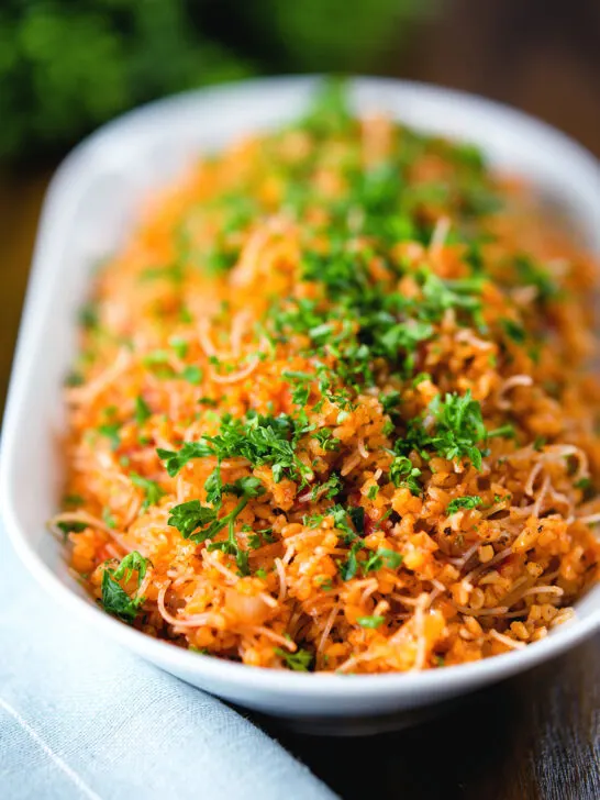 Pourgouri Cypriot/Greek bulgur and vermicelli noodle pilaf garnished with fresh parsley.