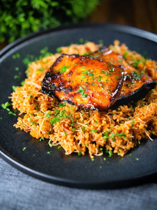 Cypriot pourgouri pilafi served with honey glazed halloumi and fresh parsley.