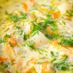 Close-up Polish zupa ogorkowa or pickle (sour) cucumber soup with fresh dill.