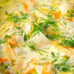 Close-up Polish zupa ogorkowa or pickle (sour) cucumber soup with fresh dill.