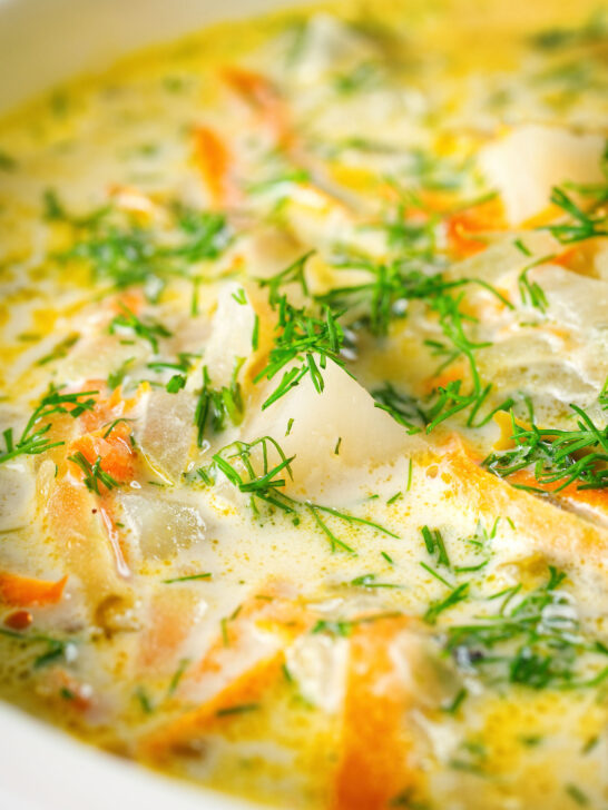 Close-up Polish zupa ogorkowa or pickle (sour) cucumber soup with fresh dill.