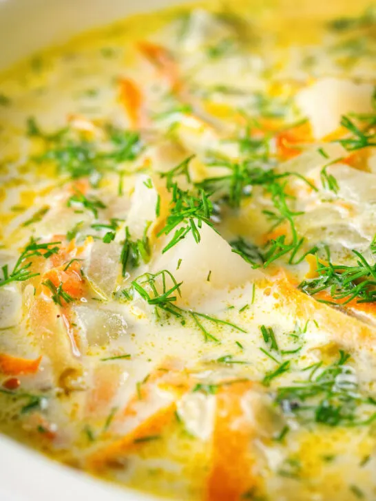 Close-up Polish zupa ogorkowa or pickle (sour) cucumber soup with fresh dill.