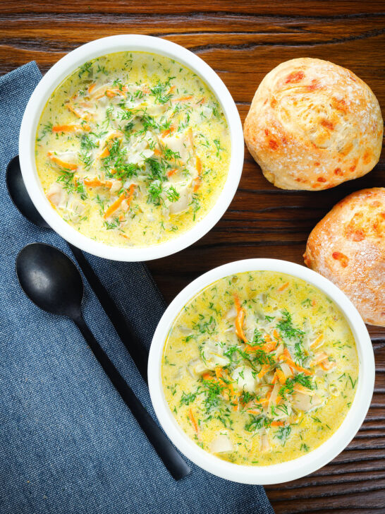 Overhead Polish zupa ogorkowa or pickle (sour) cucumber soup with fresh dill.