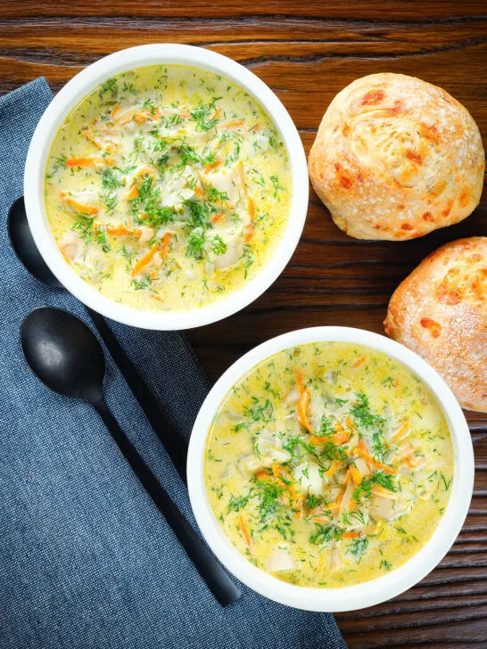Overhead Polish zupa ogorkowa or pickle (sour) cucumber soup with fresh dill.