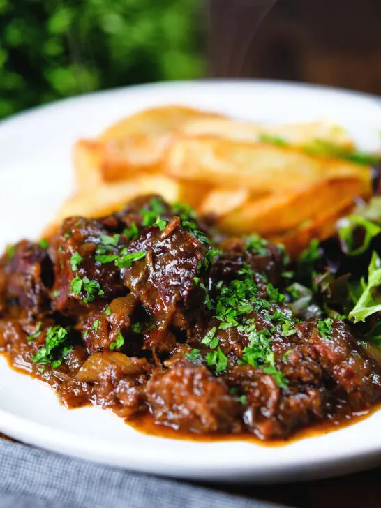 Belgian carbonnade flamande (beef, onion and beer stew) served with chips.