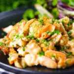 Cauliflower cheese pasta bake served with a side salad.