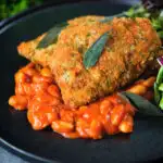 Breaded and fried chicken Milanese served with Italian inspired fagioli all'uccalletto.
