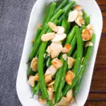 Overhead garlic green beans amandine aka almondine.