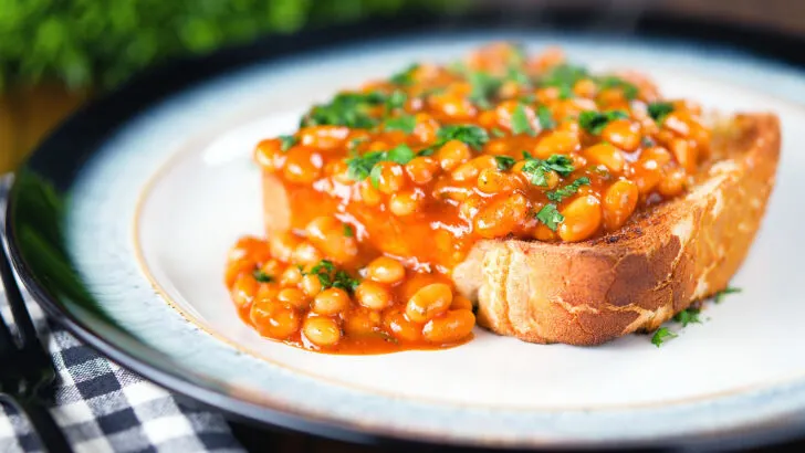 Indian spiced masala baked beans on toast garnished with fresh coriander.