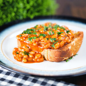 Indian spiced masala baked beans on toast garnished with fresh coriander.