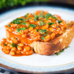 Indian-inspired spicy masala baked beans on toast with fresh coriander.