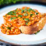 Indian-inspired spicy masala baked beans on toast with fresh coriander.