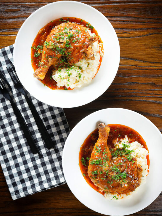 Overhead poulet au vinaigre, chicken legs in garlic and vinegar served with celeriac mash.