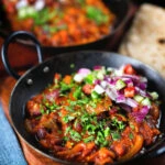 Rajma masala (kidney bean curry) served with kachumber salad and homemade chapatis.