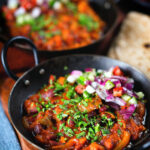 Rajma masala (kidney bean curry) served with kachumber salad and homemade chapatis.