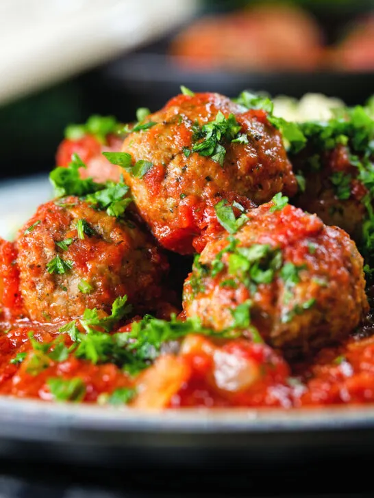 Close-up spicy Moroccan-influenced lamb (kefta) meatball tagine.