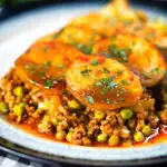 Minced lamb (keema) and potato hotpot with Indian-influenced flavours served with cabbage poriyal.