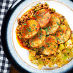 Overhead minced lamb (keema) and potato hotpot with Indian-influenced flavours served with cabbage poriyal.