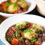 Rich red wine and port venison stew or casserole with suet dumplings.
