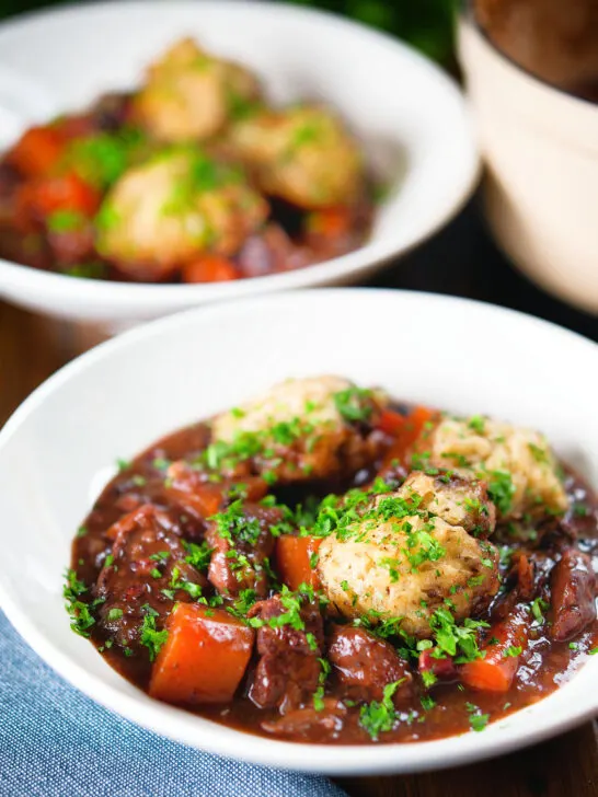 Rich red wine and port venison stew or casserole with suet dumplings.