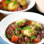 Rich red wine and port venison stew or casserole with suet dumplings.