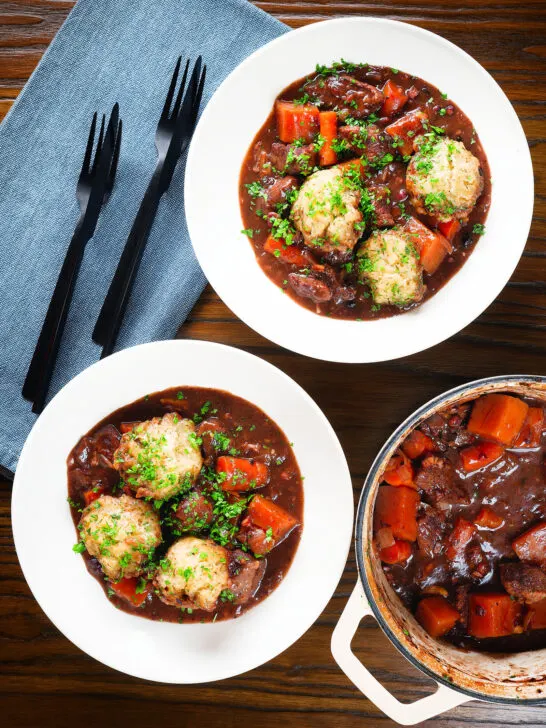 Overhead rich red wine and port venison stew or casserole with suet dumplings.
