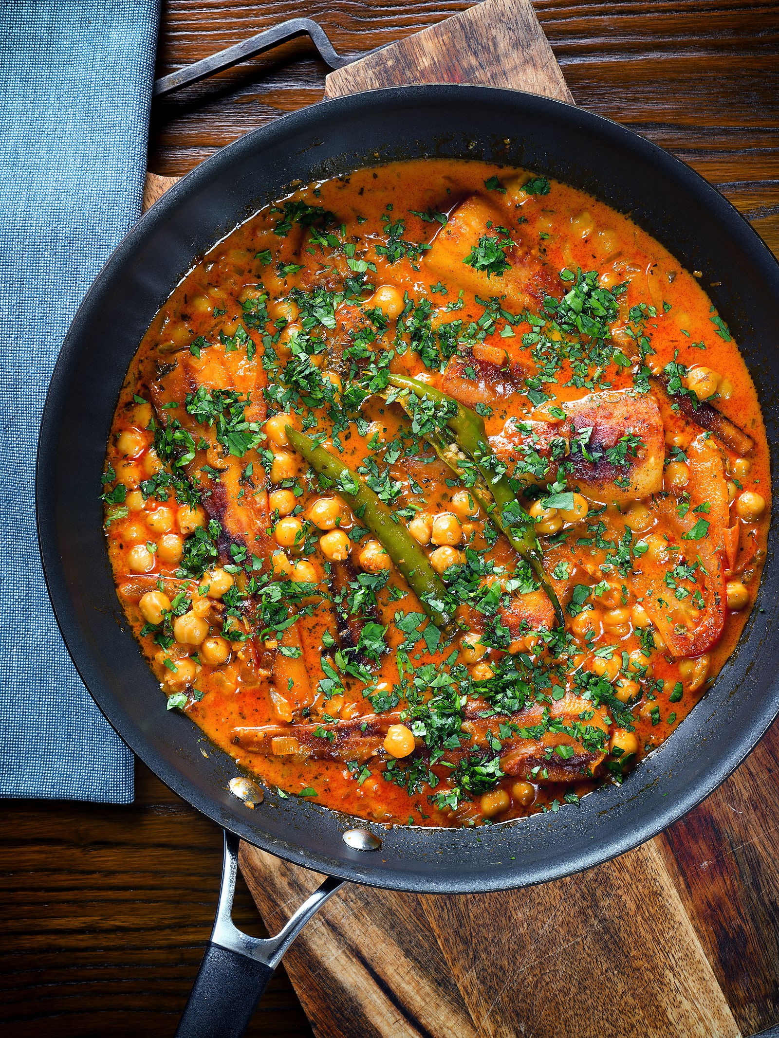 Overhead vegetarian chickpea and parsnip curry in a cooking pan.