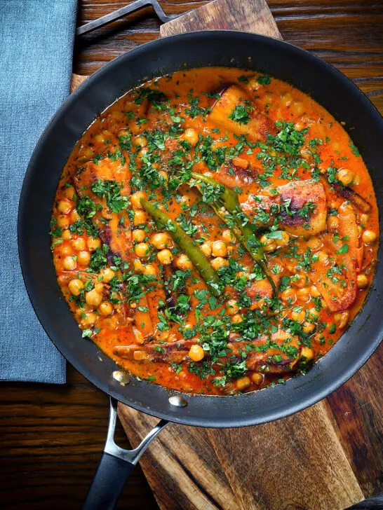 Overhead vegetarian chickpea and parsnip curry in a cooking pan.