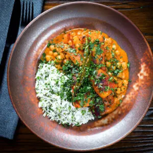 Vegan chickpea and parsnip curry served with coriander rice.