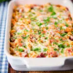 Corned beef and tomato macaroni pasta bake with a cheesy topping.